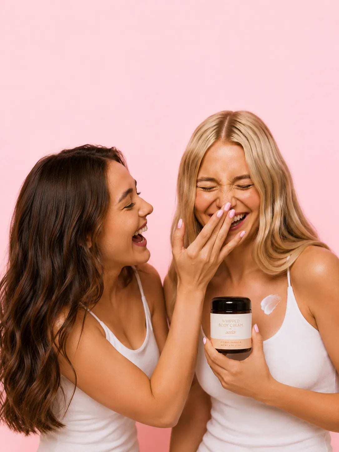 Two women laughing together